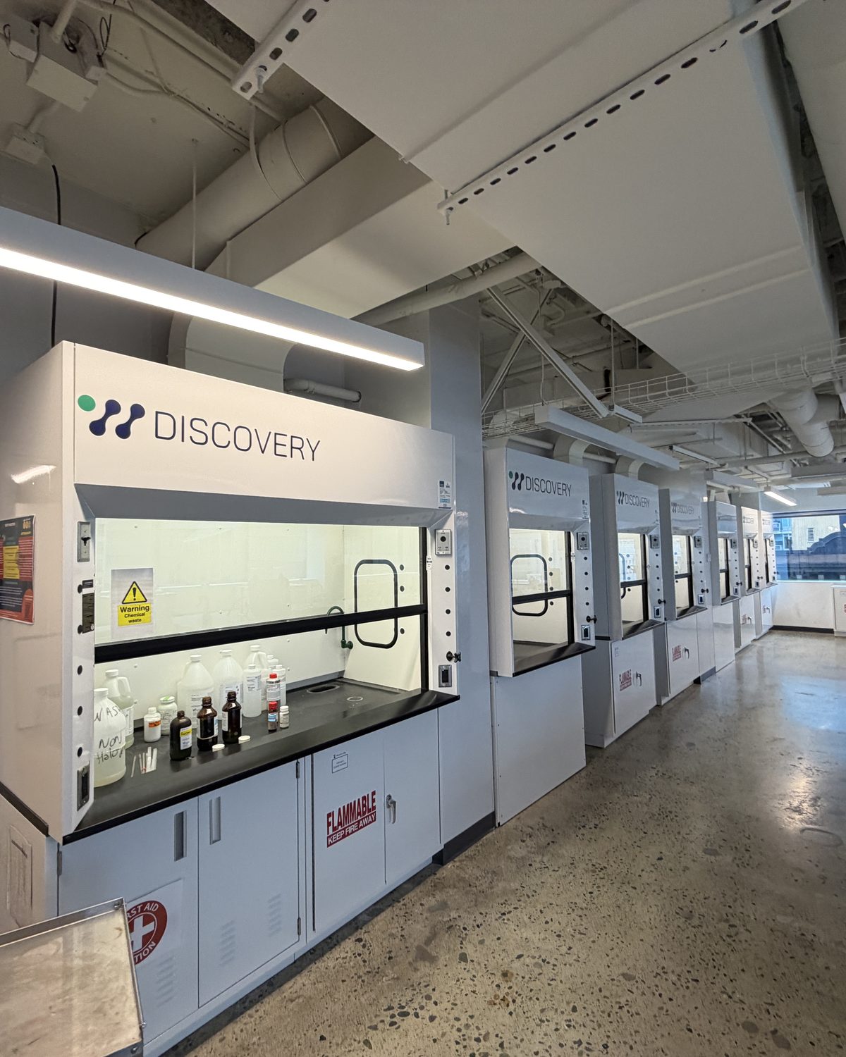 Row of chemical fume hoods in a research laboratory