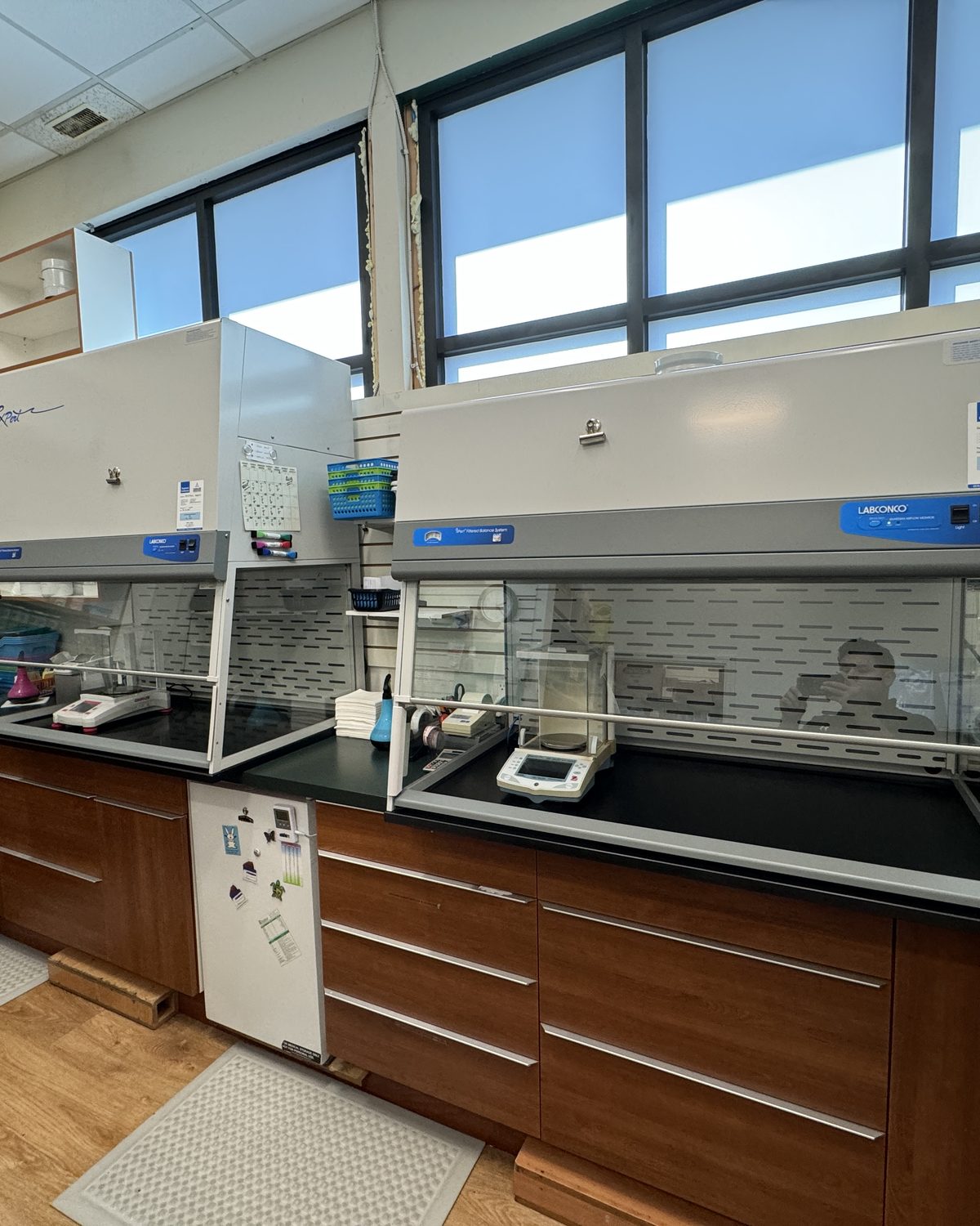 Two containment ventilated enclosures with analytical balance in an active compounding pharmacy